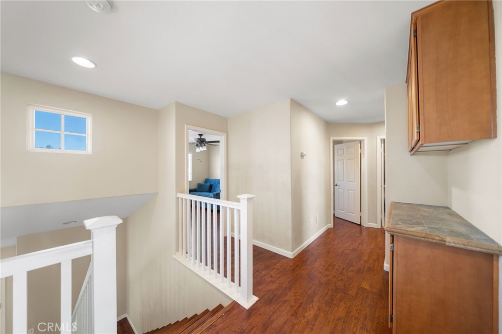 29611 Camino Cristal Menifee, CA 92584 - Photo 16 of 33 a view of a hallway with entryway and wooden floor