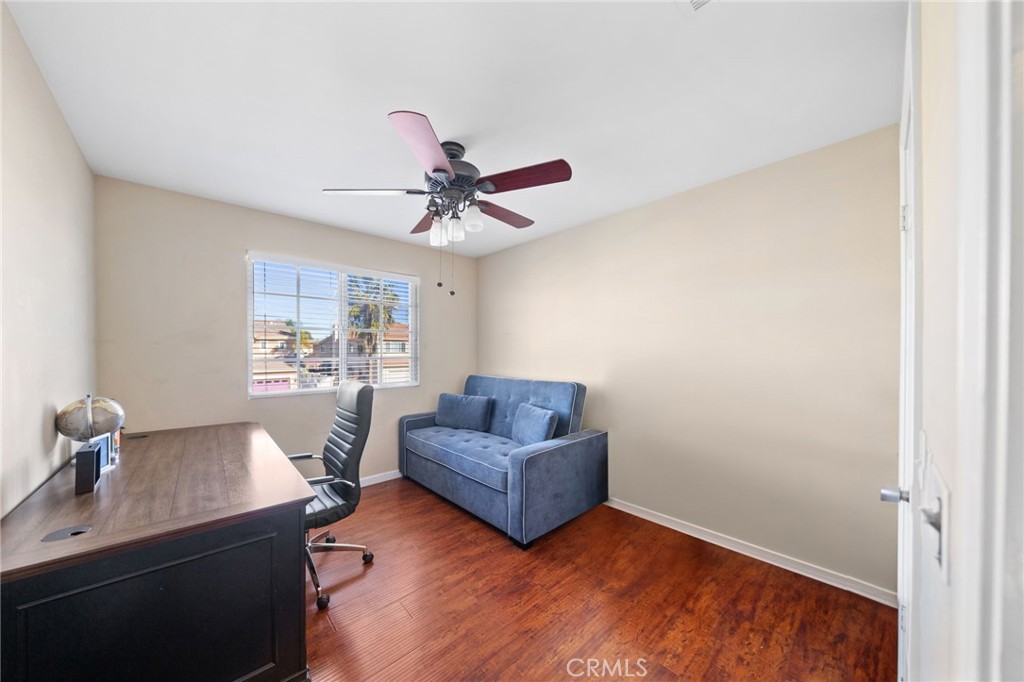 29611 Camino Cristal Menifee, CA 92584 - Photo 17 of 33 a living room with a couch and chandelier