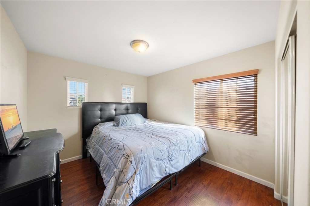 29611 Camino Cristal Menifee, CA 92584 - Photo 18 of 33 a bedroom with a bed and a window