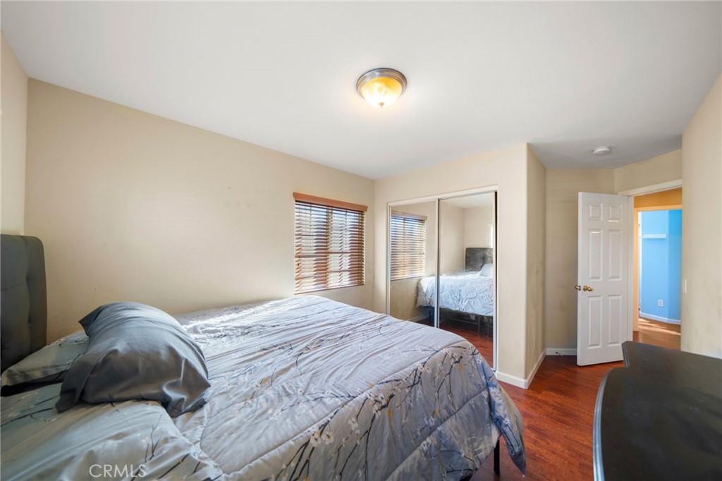 29611 Camino Cristal Menifee, CA 92584 - Photo 19 of 33 a bedroom with a bed and a window