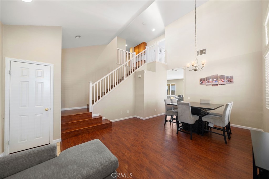 29611 Camino Cristal Menifee, CA 92584 - Photo 3 of 33 a view of a livingroom with furniture and wooden floor