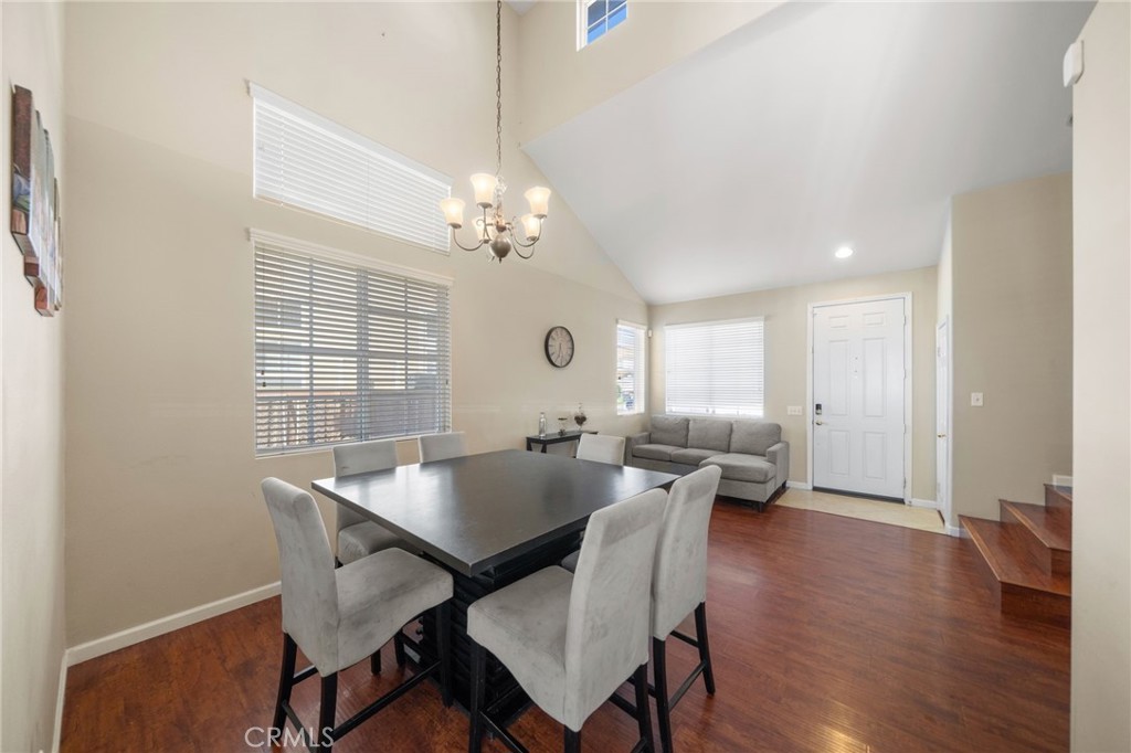 29611 Camino Cristal Menifee, CA 92584 - Photo 4 of 33 a view of a dining room with furniture window and wooden floor
