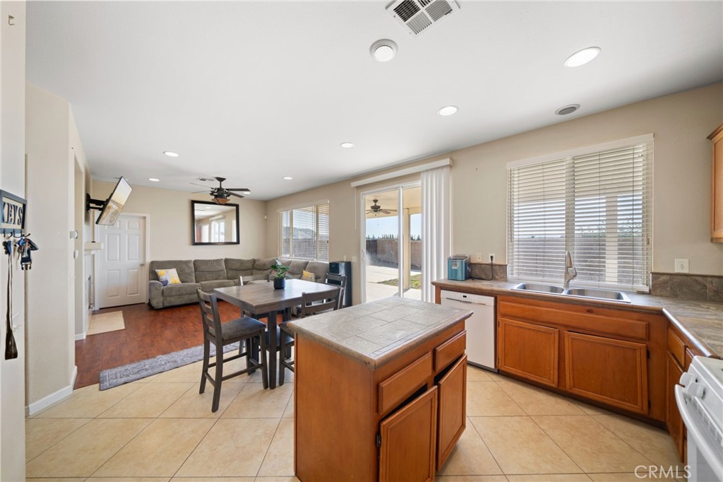 29611 Camino Cristal Menifee, CA 92584 - Photo 8 of 33 a open kitchen with a sink and cabinets