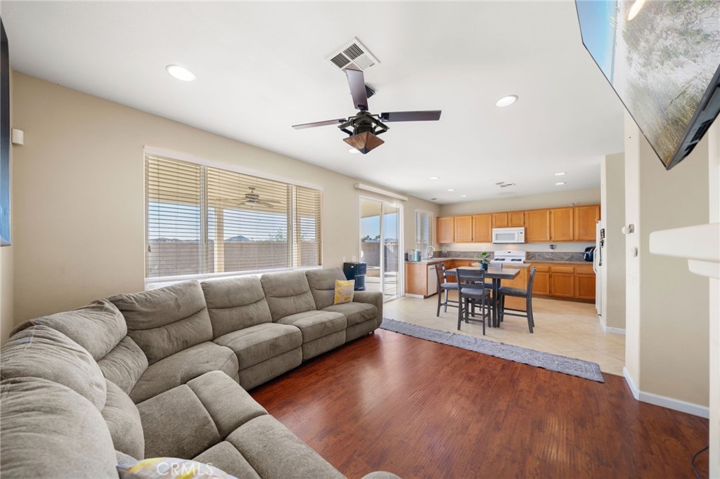 29611 Camino Cristal Menifee, CA 92584 - Photo 10 of 33 a living room with furniture and a large window