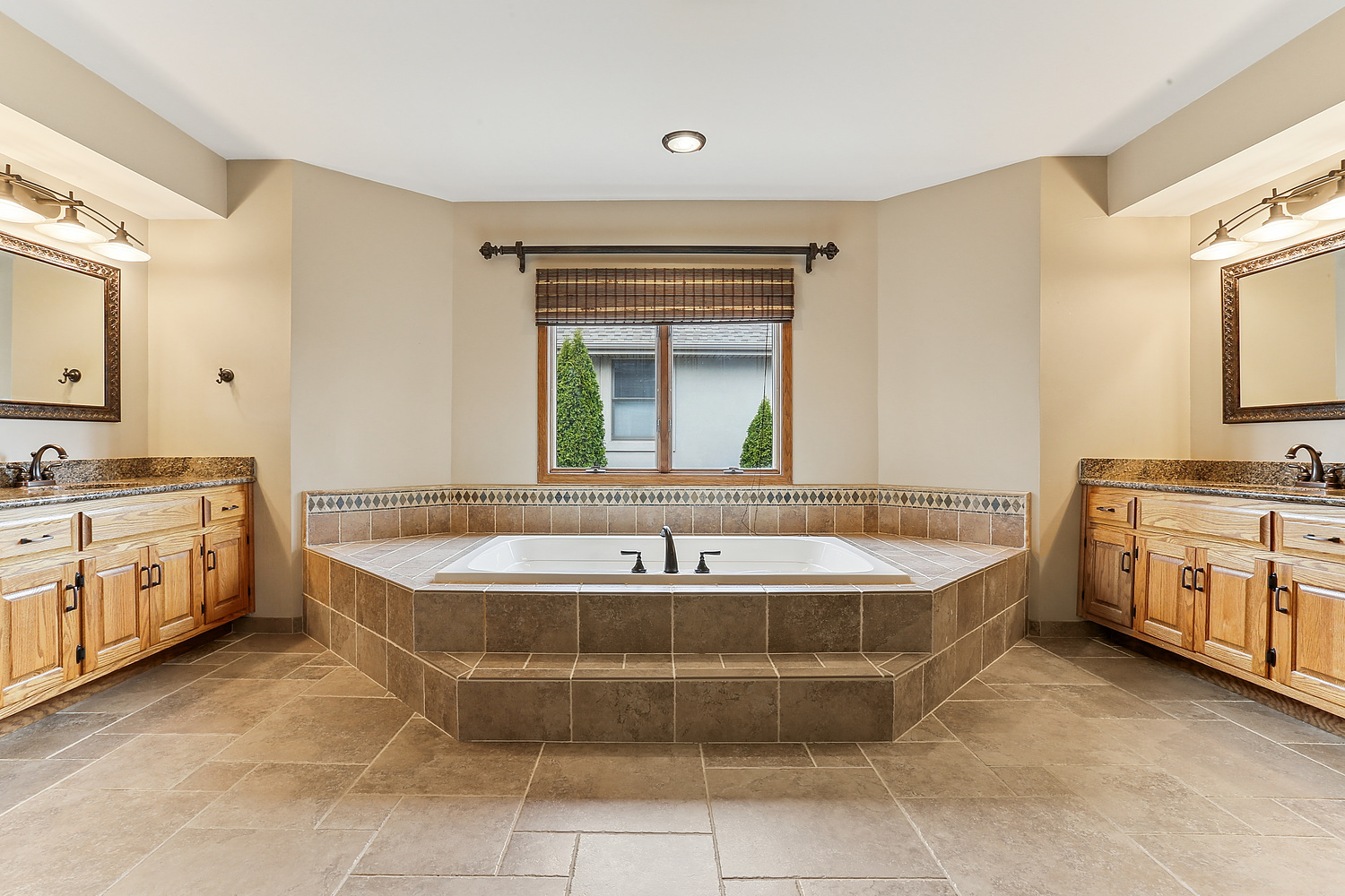 13629 South Kickapoo Trail Homer Glen, IL 60491 - Photo 25 of 28 a spacious bathroom with a tub sink and mirror