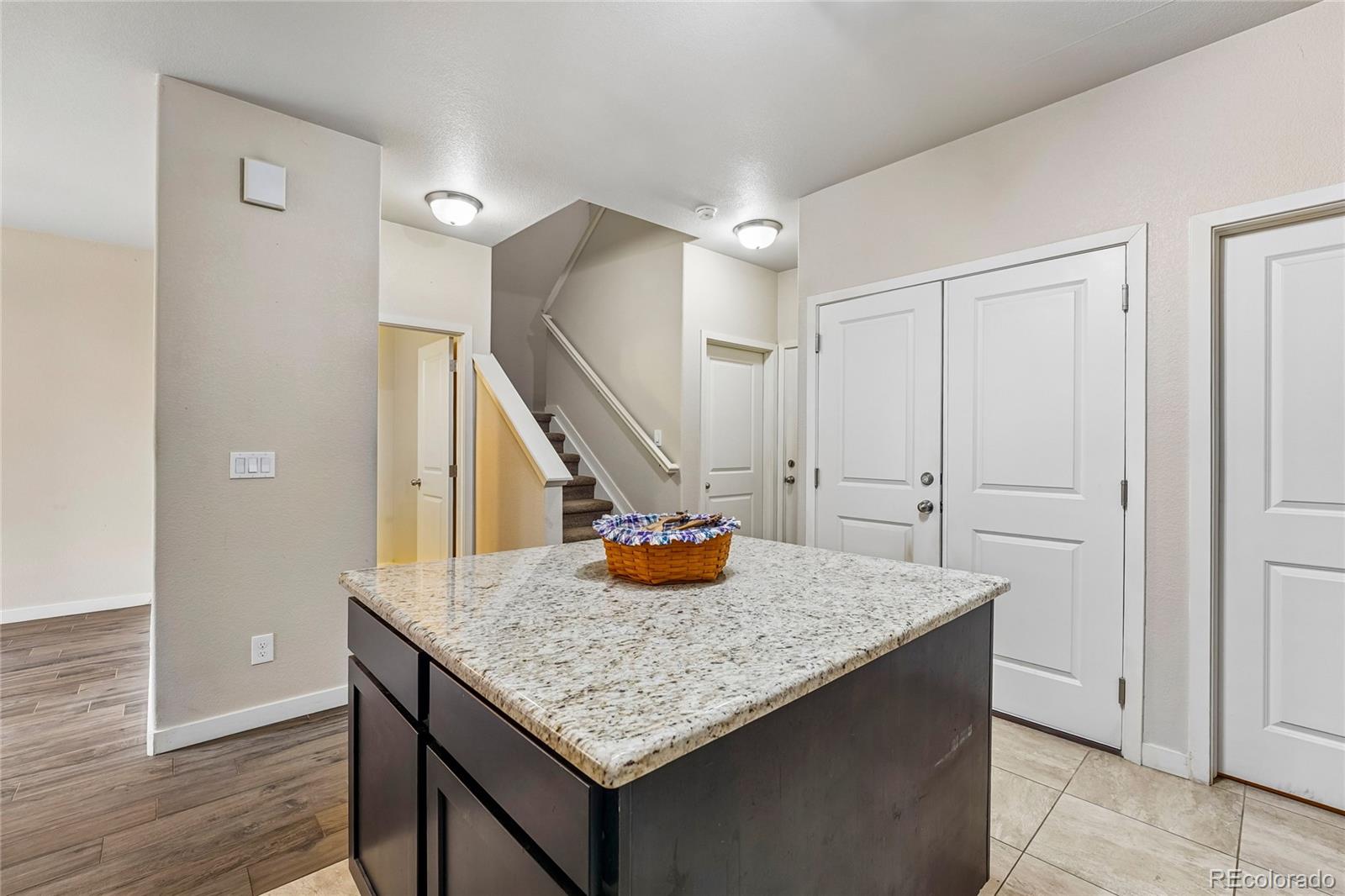 3611 South Perth Circle, Unit 102 Aurora, CO 80013 - Photo 14 of 40 a kitchen with sink and a refrigerator
