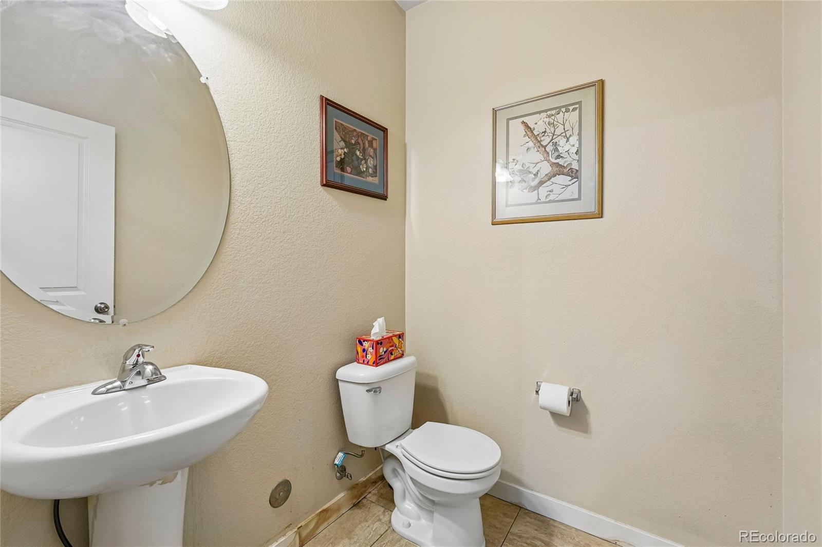 3611 South Perth Circle, Unit 102 Aurora, CO 80013 - Photo 16 of 40 a bathroom with a sink mirror and a toilet