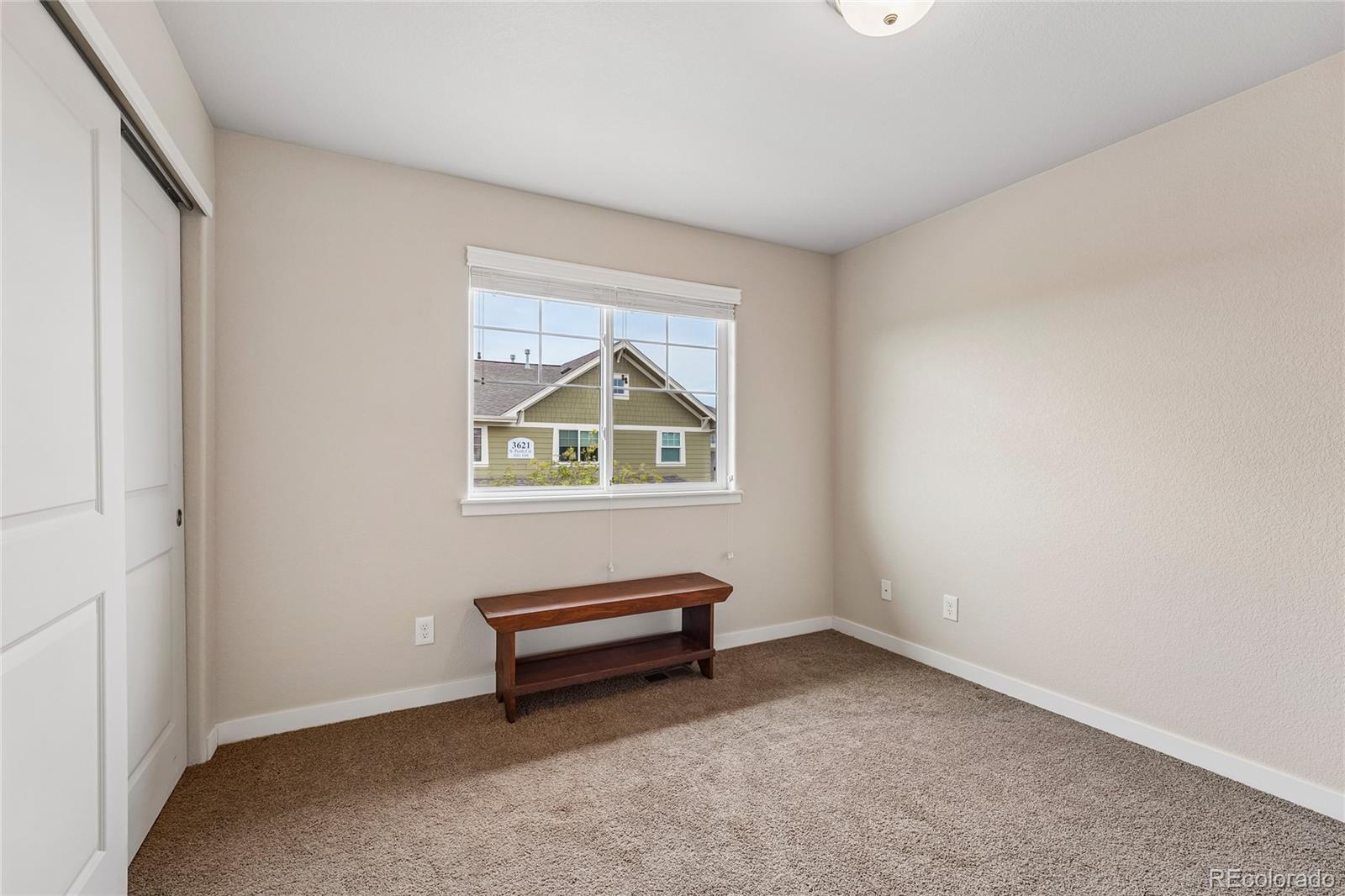3611 South Perth Circle, Unit 102 Aurora, CO 80013 - Photo 21 of 40 a view of room with air conditioner and window