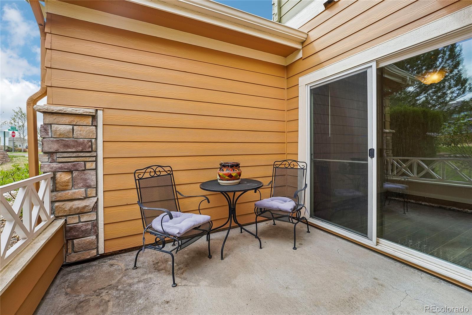 3611 South Perth Circle, Unit 102 Aurora, CO 80013 - Photo 34 of 40 a backyard of a house with table and chairs