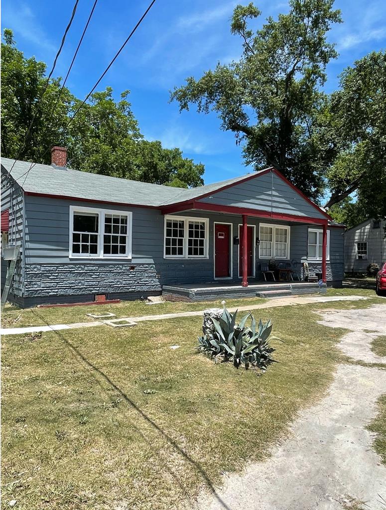 2319 6th Street Columbus, GA 31906 - Photo 1 of 4 a house with swimming pool in front of it
