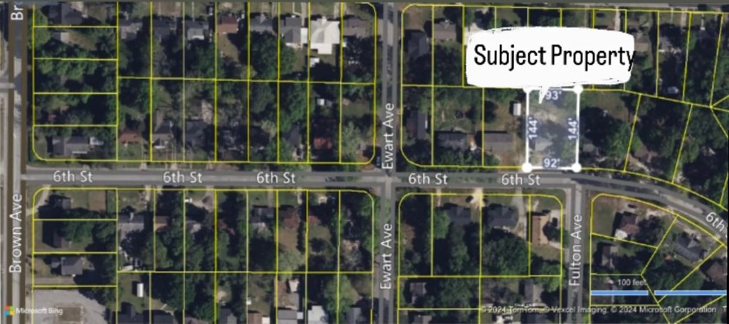 2319 6th Street Columbus, GA 31906 - Photo 2 of 4 a view of a shop with a tree in it