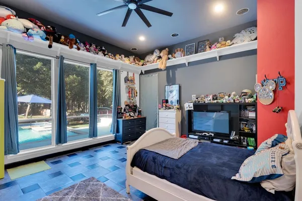 a living room with furniture and a floor to ceiling window