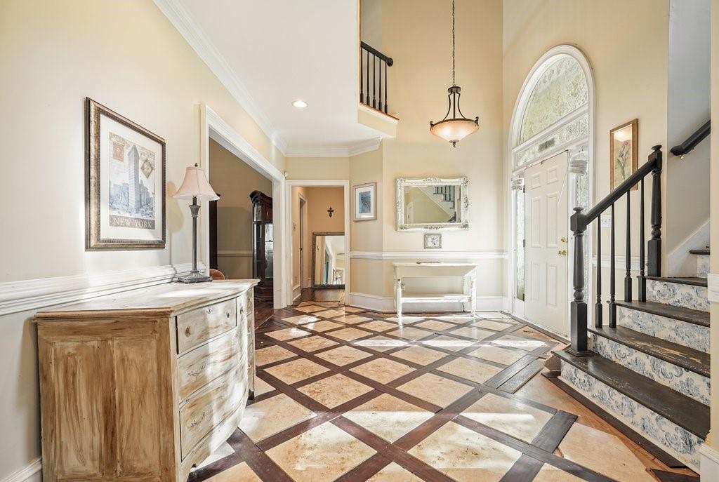 1513 Old Jones Road Alpharetta, GA 30004 - Photo 12 of 62 a living room with furniture a rug and white walls