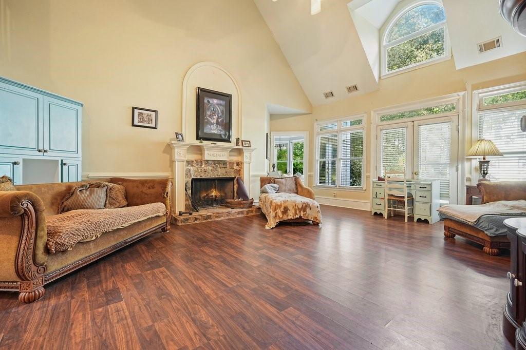 1513 Old Jones Road Alpharetta, GA 30004 - Photo 15 of 62 a living room with furniture and a fireplace