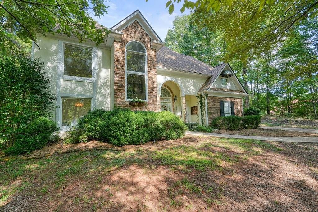 1513 Old Jones Road Alpharetta, GA 30004 - Photo 29 of 62 a front view of a house with a yard