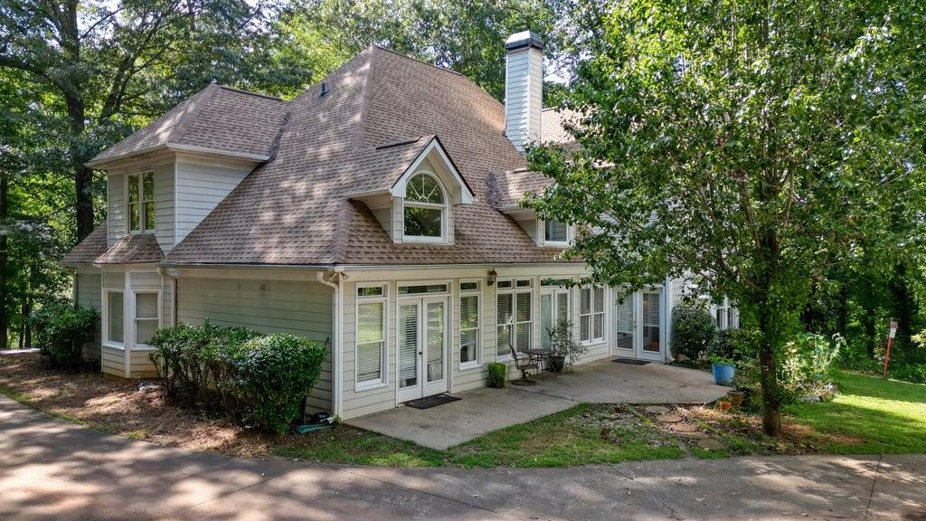 1513 Old Jones Road Alpharetta, GA 30004 - Photo 31 of 62 a front view of a house with yard and green space