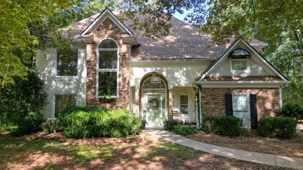 1513 Old Jones Road Alpharetta, GA 30004 - Photo 32 of 62 a front view of a house with garden