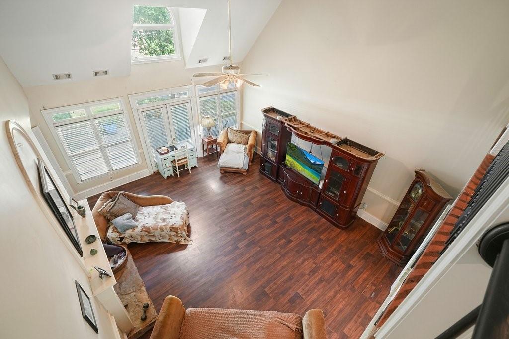 1513 Old Jones Road Alpharetta, GA 30004 - Photo 42 of 62 a living room with furniture and a fireplace