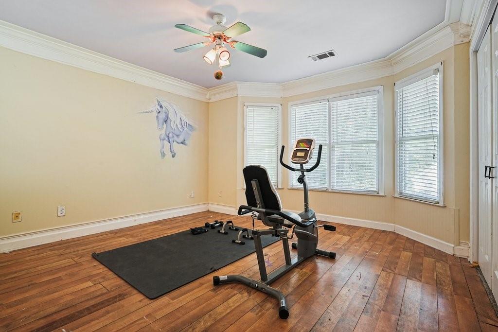 1513 Old Jones Road Alpharetta, GA 30004 - Photo 43 of 62 a view of workspace with wooden floor windows with a ceiling fan