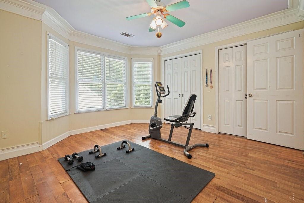 1513 Old Jones Road Alpharetta, GA 30004 - Photo 44 of 62 a view of a room with gym equipment and windows