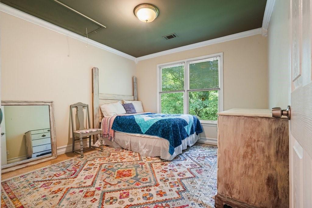 1513 Old Jones Road Alpharetta, GA 30004 - Photo 46 of 62 a bedroom with furniture and a window