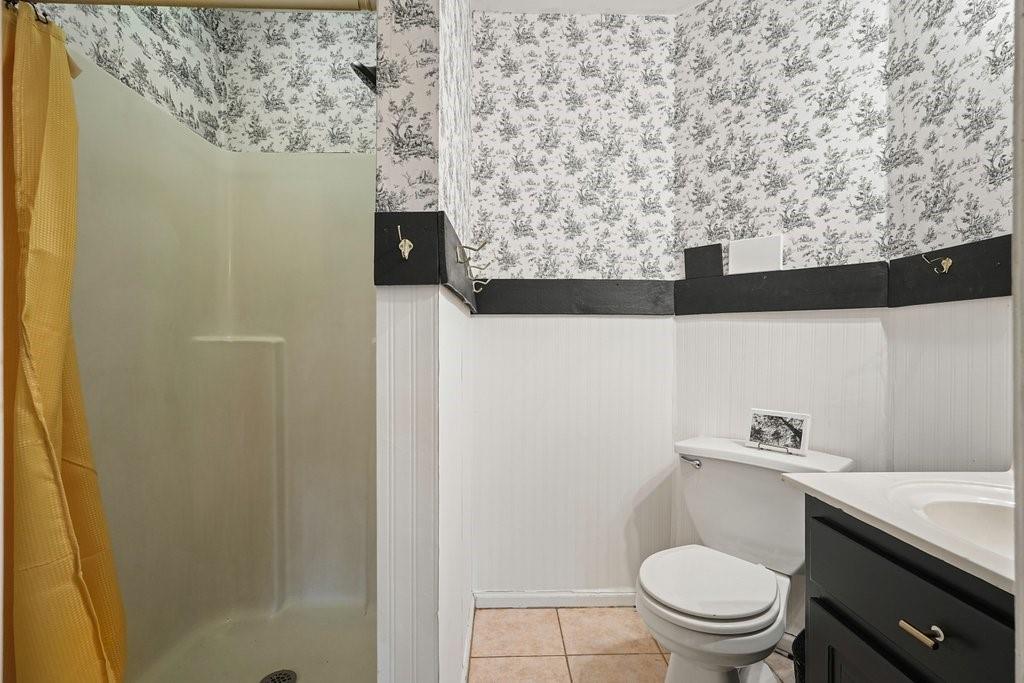 1513 Old Jones Road Alpharetta, GA 30004 - Photo 50 of 62 a bathroom with a toilet and a sink