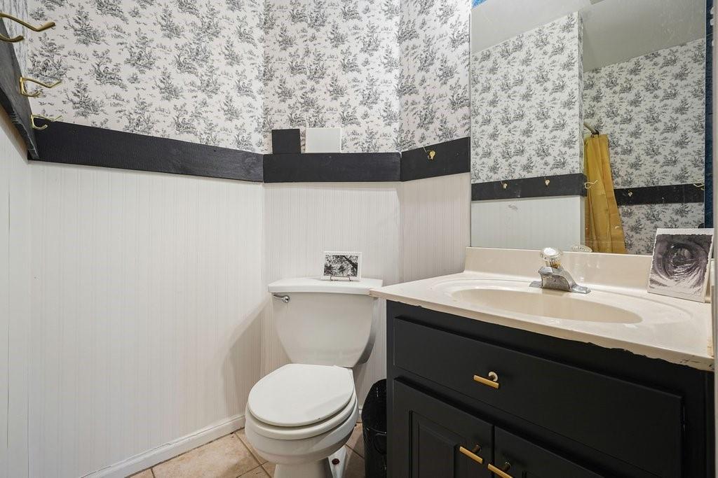 1513 Old Jones Road Alpharetta, GA 30004 - Photo 51 of 62 a bathroom with a sink mirror vanity and toilet