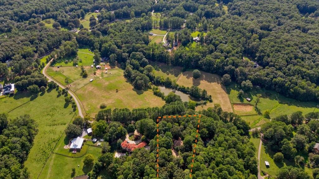 1513 Old Jones Road Alpharetta, GA 30004 - Photo 55 of 62 an aerial view of residential houses with outdoor space and swimming pool