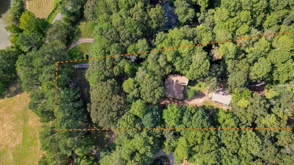 1513 Old Jones Road Alpharetta, GA 30004 - Photo 58 of 62 an aerial view of a house with a yard and outdoor seating