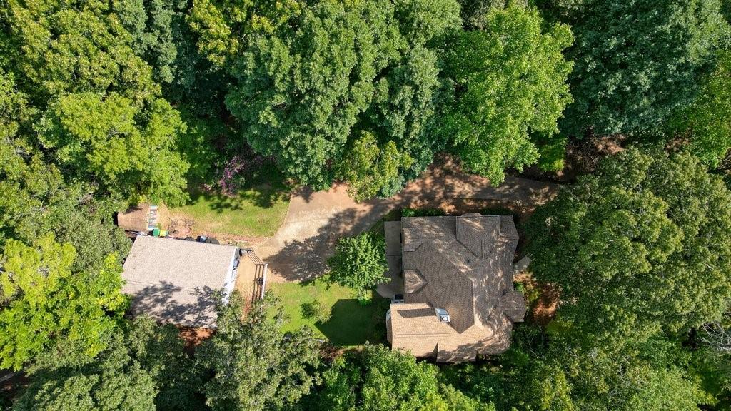 1513 Old Jones Road Alpharetta, GA 30004 - Photo 61 of 62 an aerial view of a house with a yard and trees all around