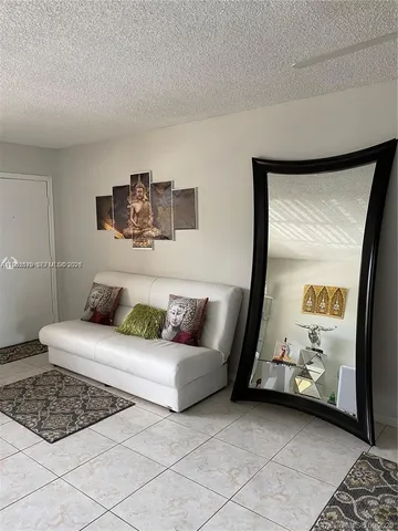 a kitchen with stainless steel appliances granite countertop a stove and a refrigerator