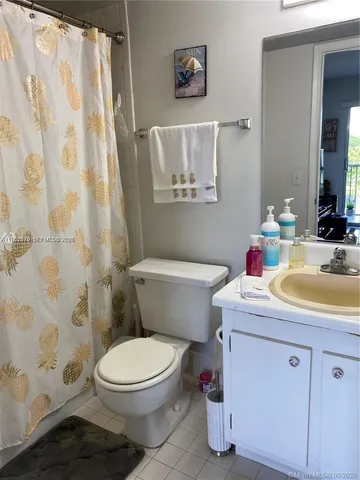 a view of a porch with furniture and backyard