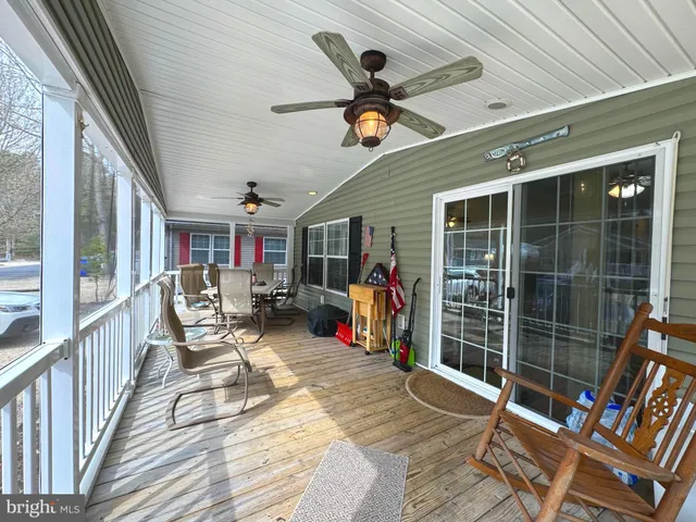 a view of a porch with furniture