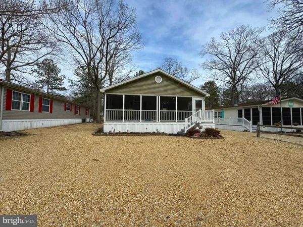 a house with trees in the background