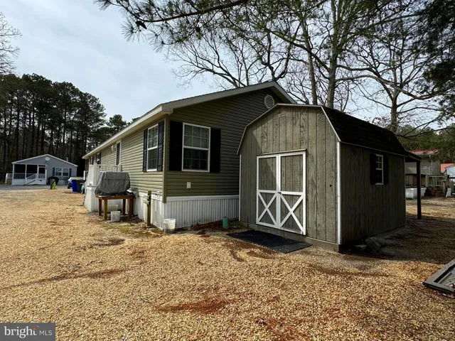 a house with trees in the background