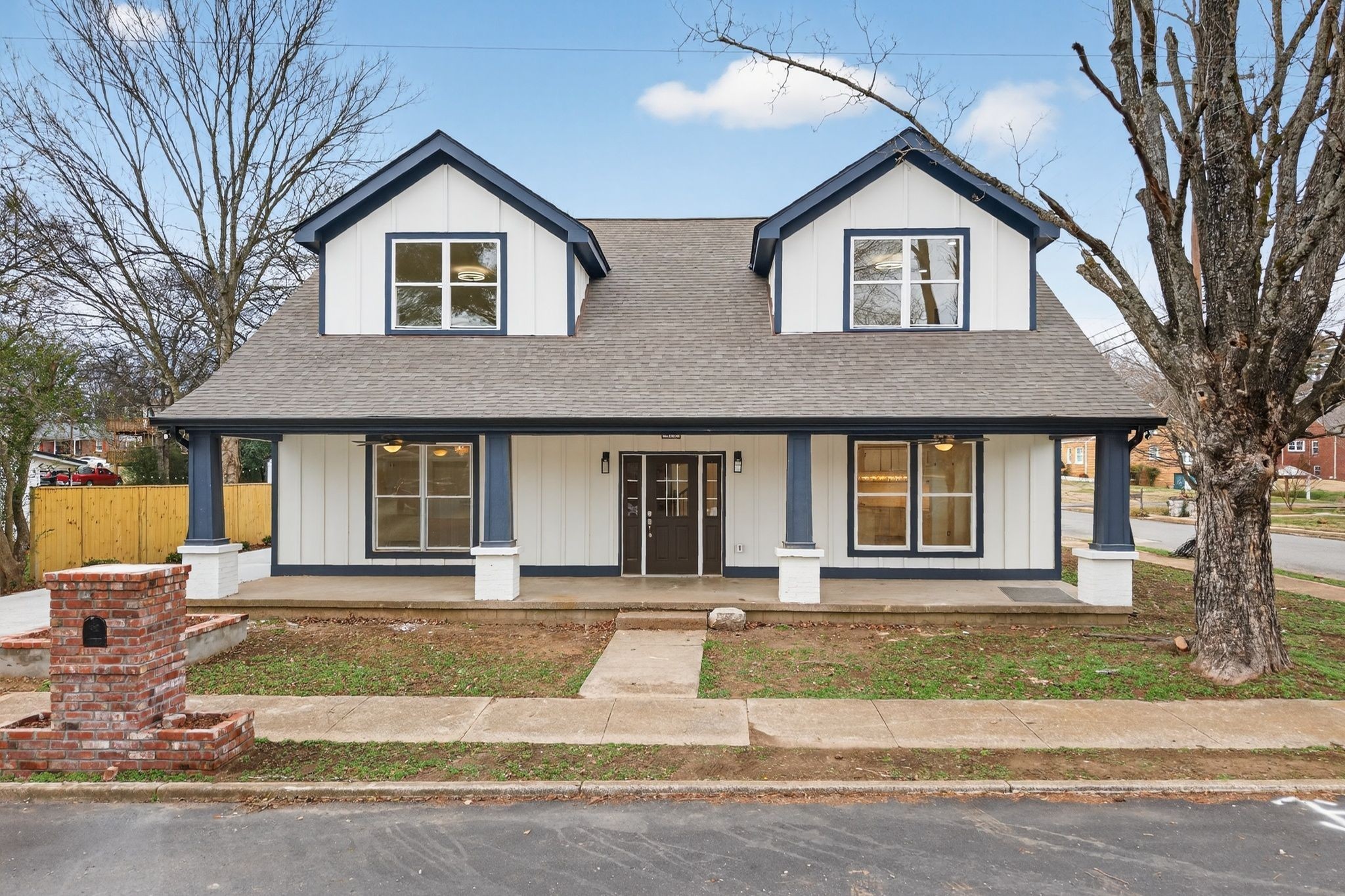 410 3rd Avenue Fayetteville, TN 37334 - Photo 1 of 49 a front view of a house with a yard and garage