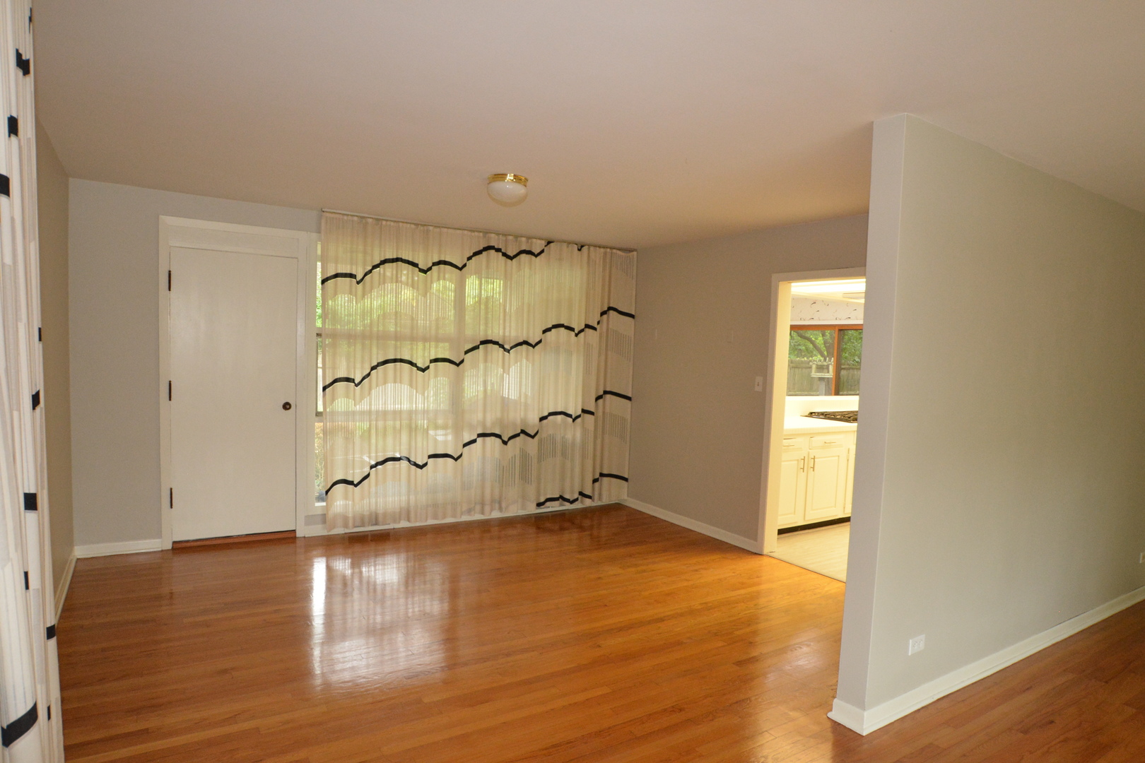 346 Park Place Glencoe, IL 60022 - Photo 4 of 15 an empty room with wooden floor and windows