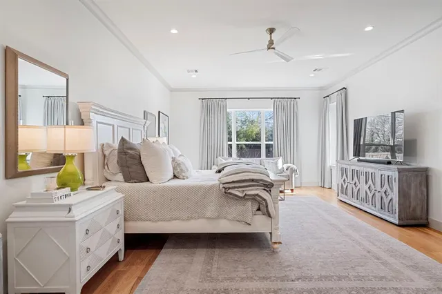 a living room with a bed furniture and a window