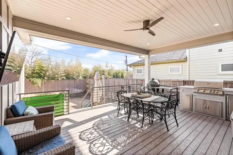 a view of a patio with a dining table and chairs