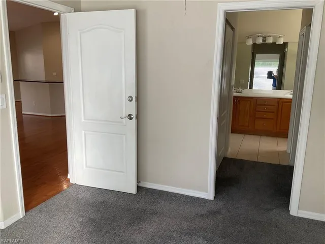a view of a closet area with a bathroom