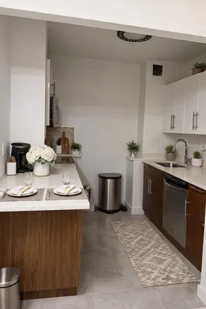 a kitchen with a sink and cabinets