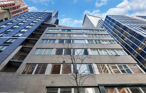 a view of balcony with wooden floor