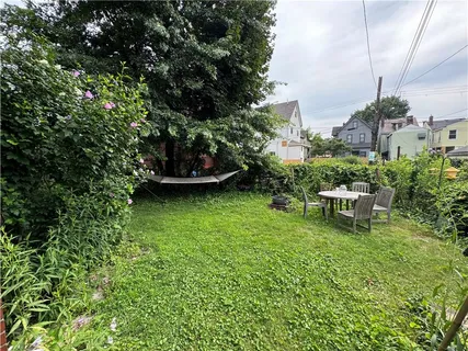 a view of a chair and tables in the garden