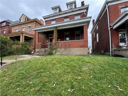 a view of a building with a yard