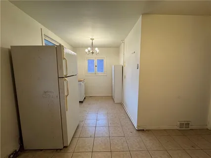 a view of a storage & utility room with a sink