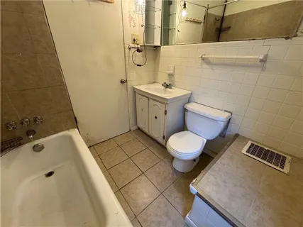 a bathroom with a toilet and a sink