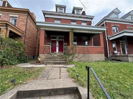 front view of house with a yard
