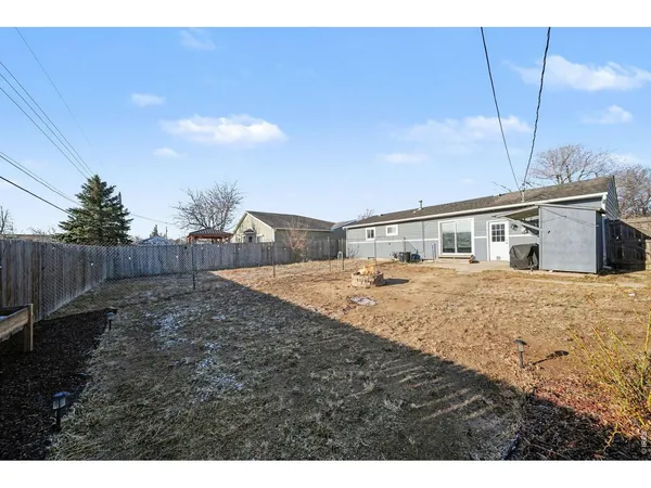 a house view with a backyard space