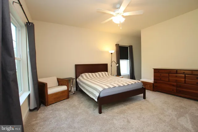 a bedroom with a bed and furniture