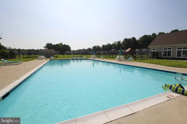a view of a swimming pool and lake